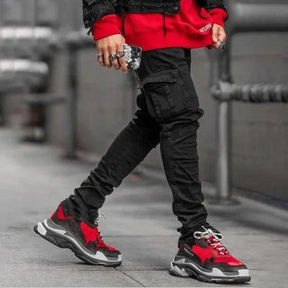 Black men's elastic denim jeans with multi pockets, slim fit cargo style, casual mid-waist joggers for daily wear.