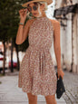 Ladies sleeveless halter neck floral dress by BACKUPMYFILESNOW.COM® with a fitted bodice and flowing skirt, perfect for summer wear.
