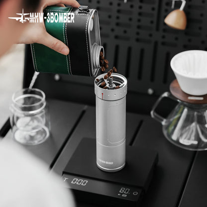 Black MHW-3BOMBER Official R3 Pro manual coffee grinder with adjustable grind settings, portable espresso tool, compact and sleek design.