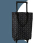 Black collapsible trolley bag with wheels, reusable shopping cart for groceries and folding grocery bags, designed for easy transport.