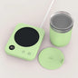Black coffee mug warmer pad with electric heater and coaster, designed for maintaining milk tea or water temperature at home or office.