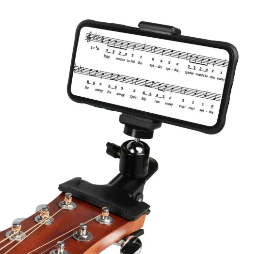 Black phone guitar clip stand by BackupMyFilesNow.com holding a smartphone for hands-free use.