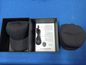 Black and red light therapy cap from BackupMyFilesNow.com with adjustable straps and multiple LED light panels for scalp treatment.