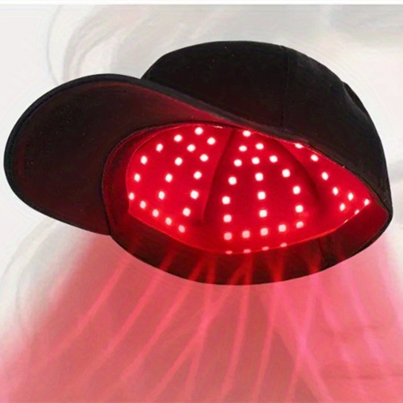 Red light therapy cap by BackupMyFilesNow.com with black and red design, featuring multiple LED light panels for scalp treatment.