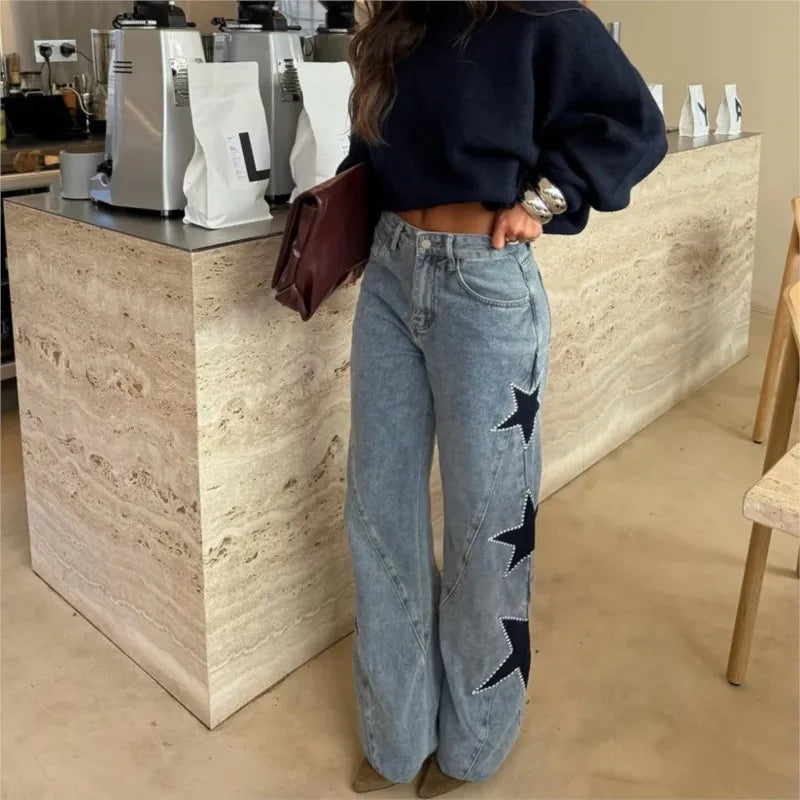 Black retro women's jeans featuring straight, loose fit with star patchwork, casual street style, and simple fashion design.