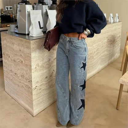 Black retro women's jeans featuring straight, loose fit with star patchwork, casual street style, and simple fashion design.
