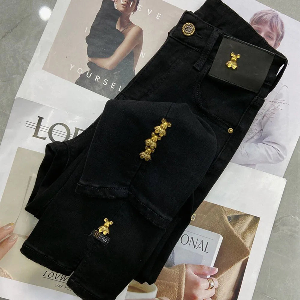 Black 2023 autumn chic denim trousers for women with wide legs, high waist, slim fit, split design, and plush texture.
