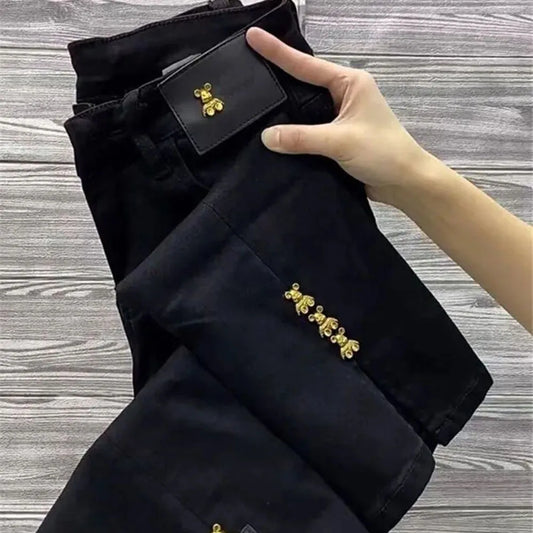 Black 2023 autumn loose chic denim trousers for women with wide leg, high waist, and split design, Korean style straight jeans.