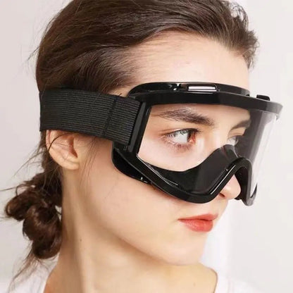 Black safety goggles with transparent lenses, anti-impact and anti-dust protection, large frame for outdoor riding safety.