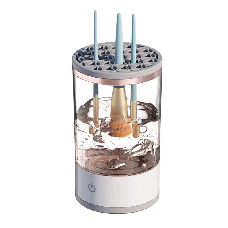 Black rechargeable makeup brush cleaner from BackupMyFilesNow.com with multiple brush slots and digital display.