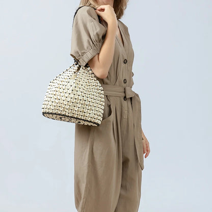 Black woven wooden bead handbag with retro design, versatile summer vacation style, handheld and shoulder carry options.