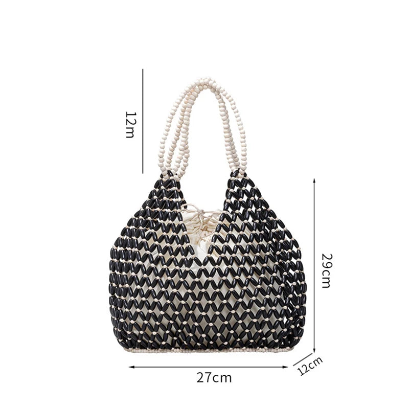 Black woven wooden bead handbag with retro design, versatile summer vacation bag, handheld and shoulder style, water bucket shape.