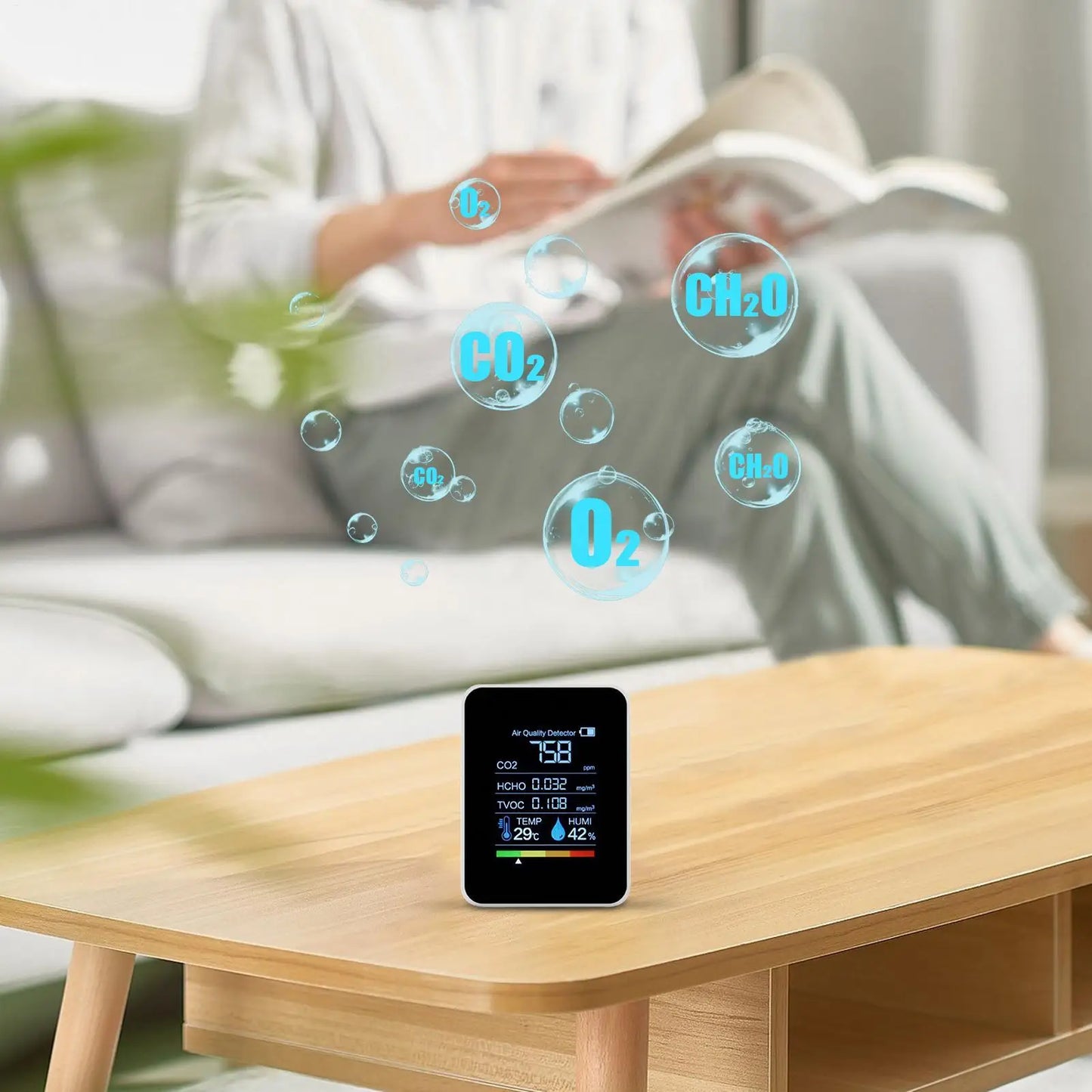 Black smart air quality monitor from BackupMyFilesNow.com showing real-time CO2, temperature, and humidity levels in a home setting.