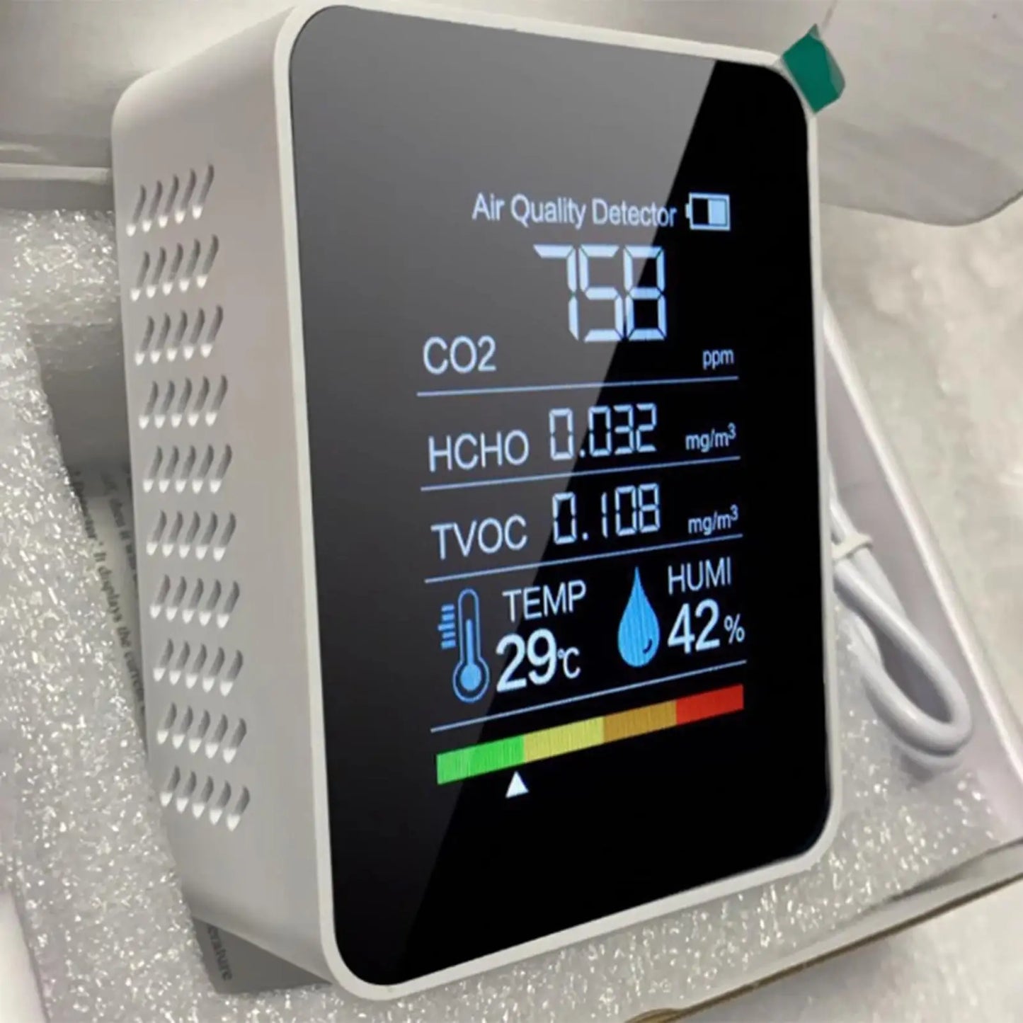 Black BackupMyFilesNow Smart Air Quality Monitor showing real-time CO2, temperature, and humidity readings for home and office.