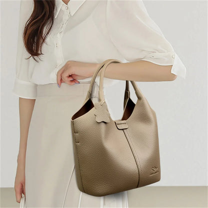 Black soft leather women's vintage shoulder handbag with large capacity and luxury designer style, featuring elegant design details.