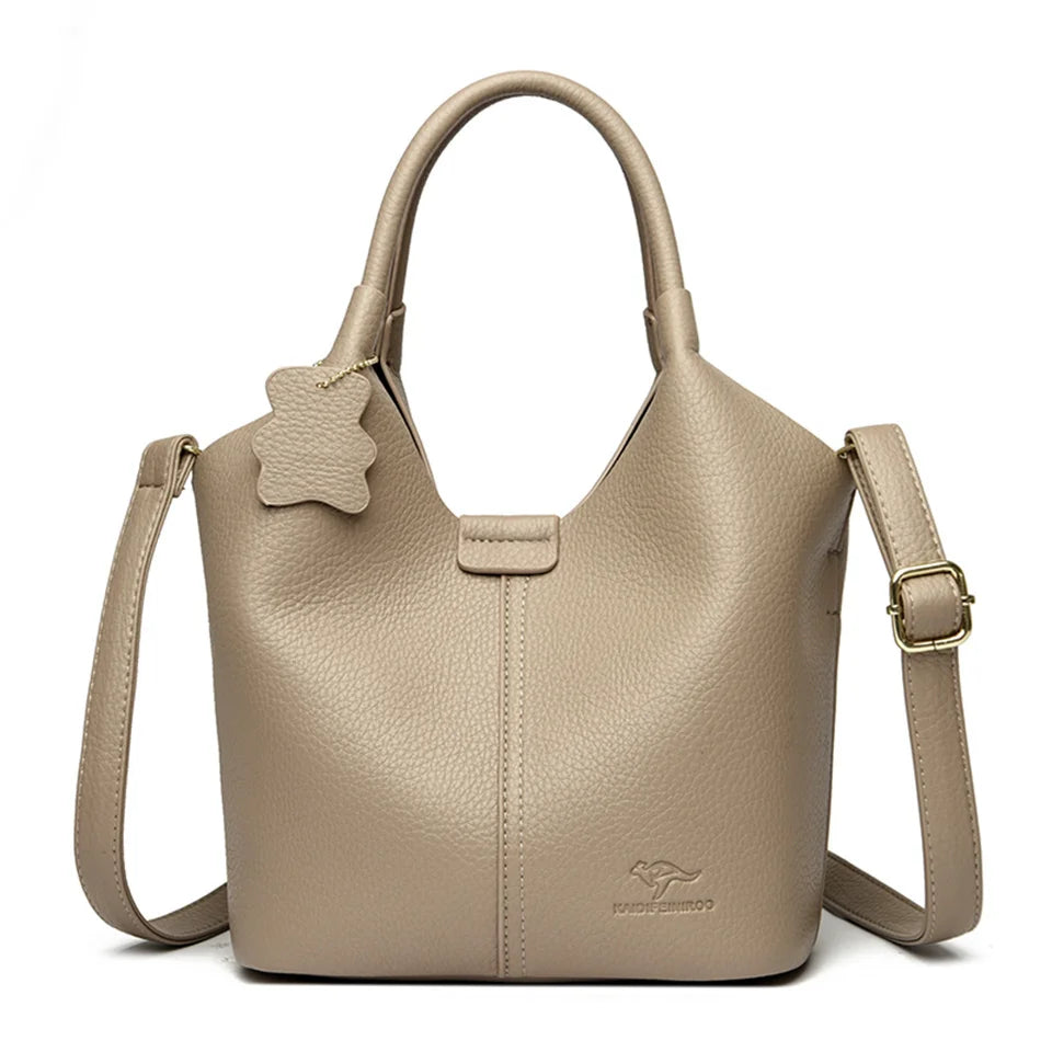Black soft leather women's vintage shoulder handbag with large capacity, luxury designer style and elegant silhouette.