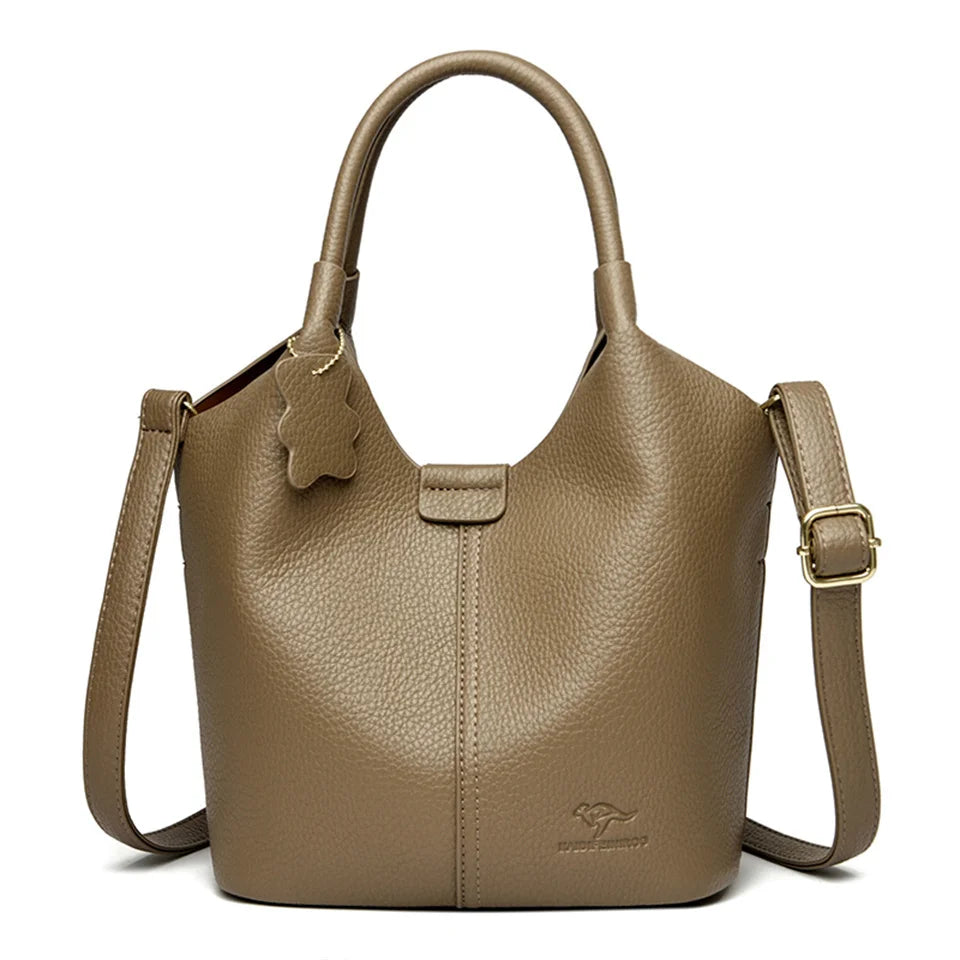 Black soft leather women's handbag featuring vintage design, large capacity, luxury style, with shoulder strap and elegant craftsmanship.