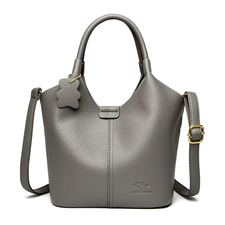 Black soft leather women's vintage shoulder handbag with large capacity, luxury designer style, and elegant shoulder strap.
