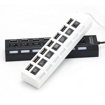 Black 7-port USB hub with on/off switch for PC, laptop, or MacBook, expanding USB connectivity with power adapter and multiple ports.