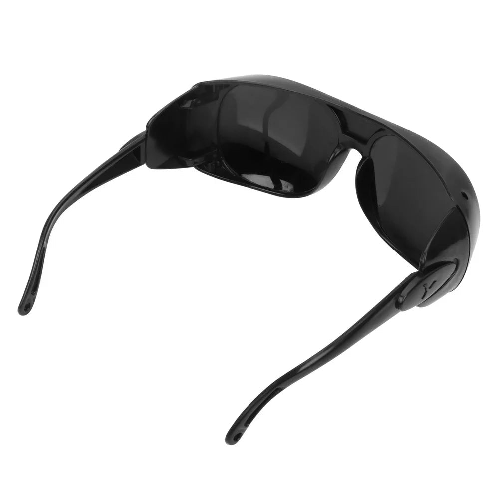 Black welding welder goggles with protective lenses for gas argon arc welding and soldering safety.