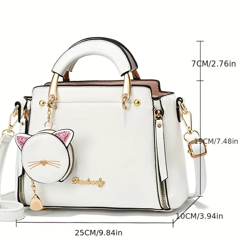 Black women's crossbody handbag with large capacity, stylish fashion purse featuring a cute cat design and multiple compartments.