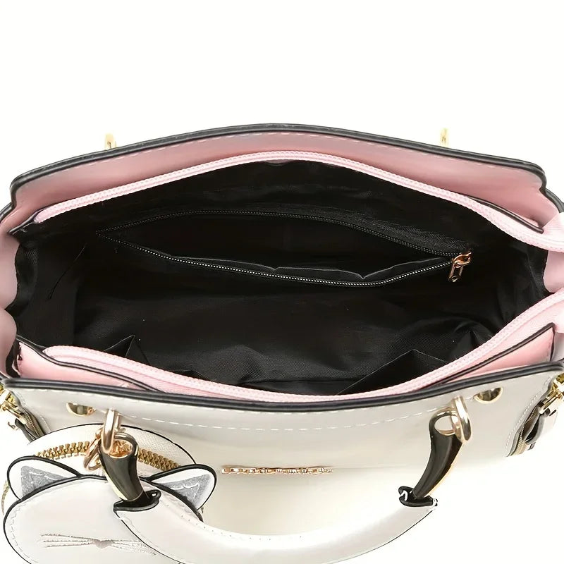 Women's black crossbody handbag with large capacity and cat design, fashionable women's purse for everyday use.