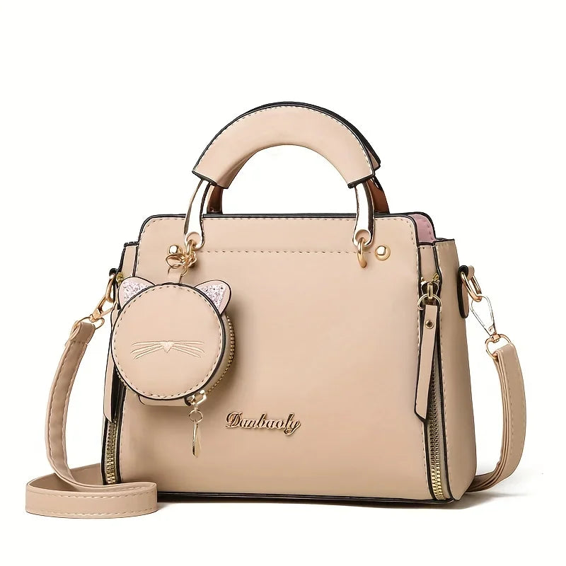 Black women's fashion handbag with crossbody strap and large capacity, featuring a stylish cat design for versatile use.
