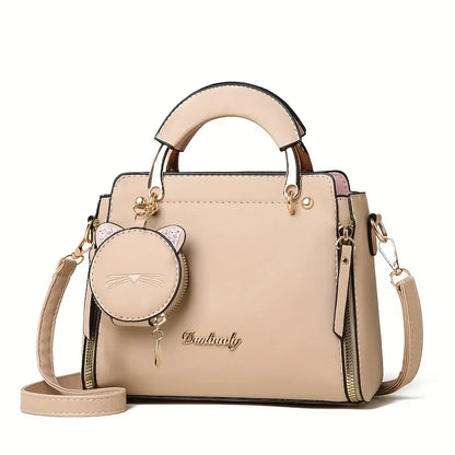 Black women's fashion handbag with crossbody strap and large capacity, featuring a stylish cat design for versatile use.