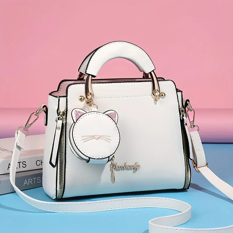 Black women's crossbody handbag with large capacity, featuring a stylish cat design and fashionable style for women.