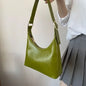 Avocado green women's shoulder handbag with a sleek hobo design, perfect for spring and summer commuter style.