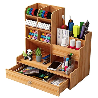 Black wooden desk organiser with compartments, pen holder, and drawer for stationery storage in home office or school setting.