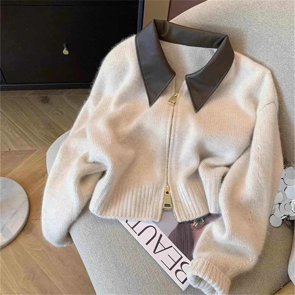 Black knitted women's cardigan sweater with long sleeves, turn collar, loose fit, suitable for autumn winter fashion.