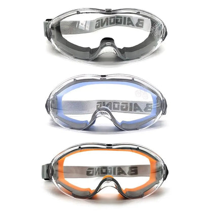 Industrial grade safety goggles with clear anti-fog lenses, designed to fit over glasses for eye protection in lab or industrial settings.