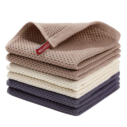 Blue cotton dish towels with honeycomb pattern, soft, absorbent kitchen rags, ideal for cleaning and face washing.