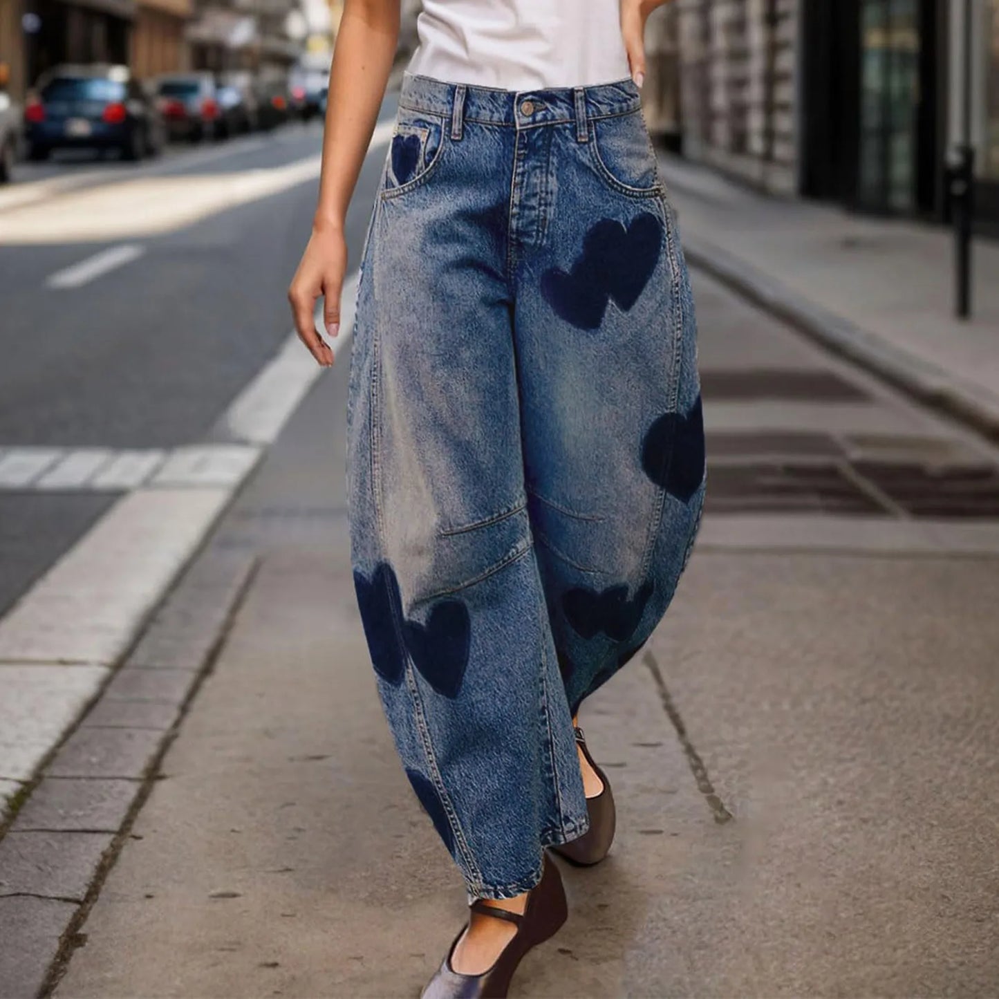 Woman wearing vintage blue barrel jeans with mid-rise heart print denim, ankle-length, casual summer baggy pants.