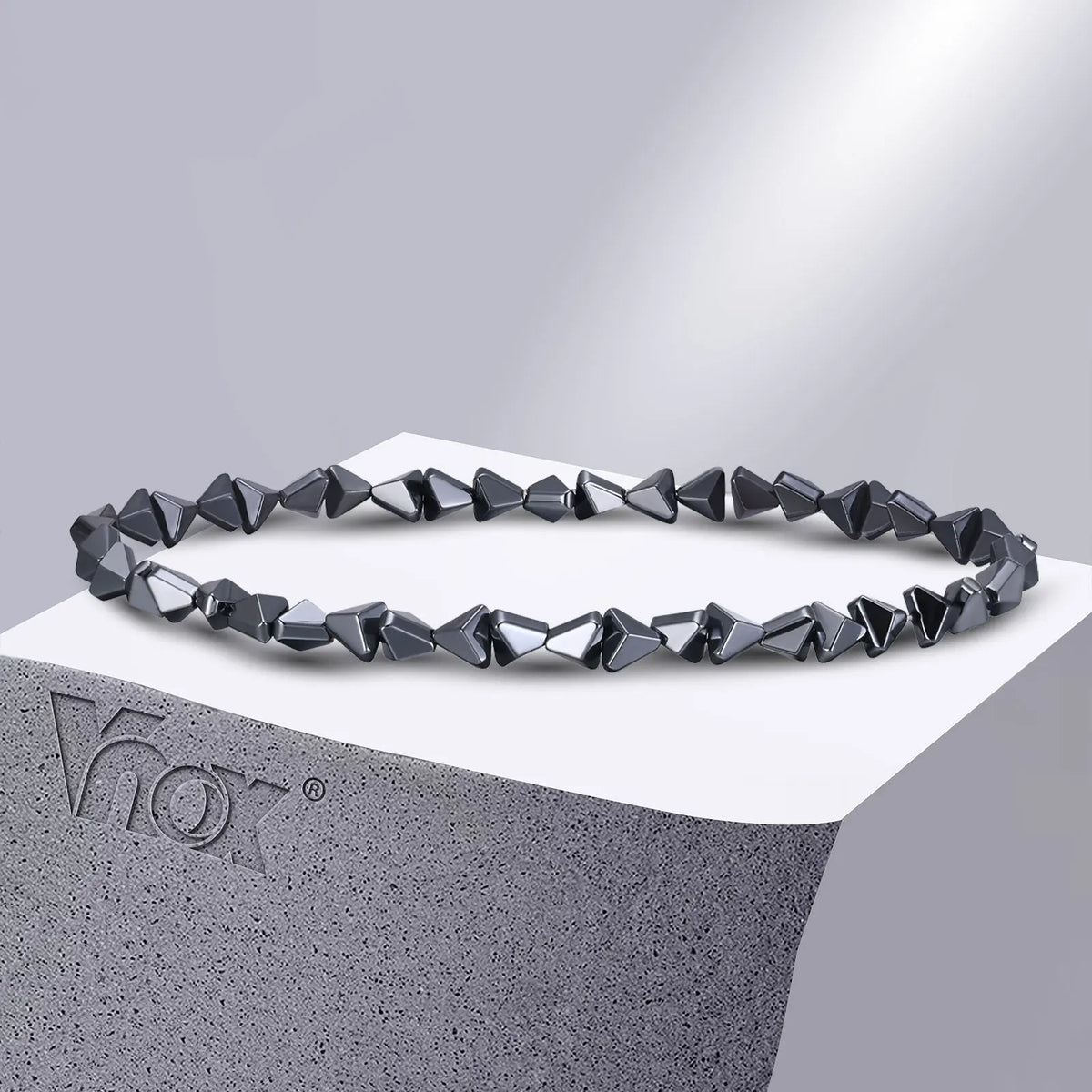 Black triangle beads bracelet for men and women, unisex stretch hematite wristband with handmade design.