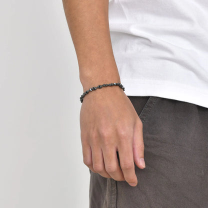 Stylish black triangle beads bracelet for men and women, unisex stretch hematite wristband jewelry with handmade design.