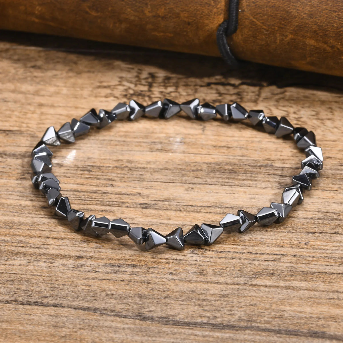 Black triangle beads bracelet for men and women, unisex stretch hematite jewelry with handmade Gallstone design.