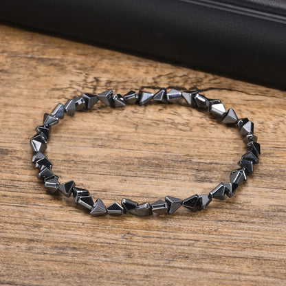 Black triangle beads bracelet for men and women, unisex stretch hematite wristband with handmade design and stylish jewelry appeal.