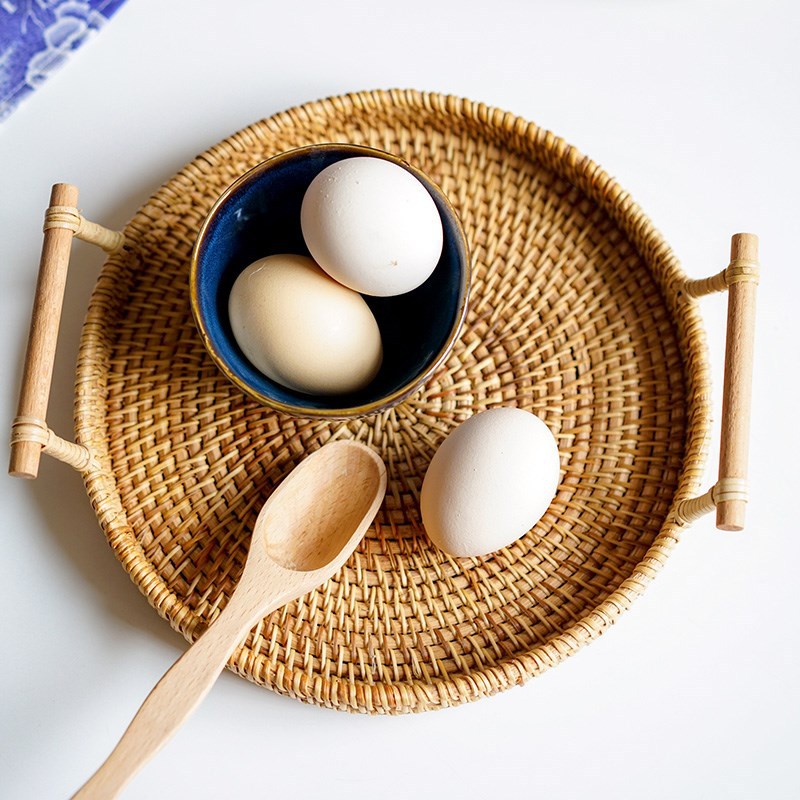 Upgraded rattan woven storage basket for snacks and fruits, featuring a natural design and sturdy handle for easy carrying.