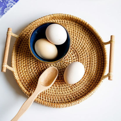 Upgraded rattan woven storage basket for snacks and fruits, featuring a natural design and sturdy handle for easy carrying.
