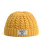 Brown Brooklyn knitted beanie cap for men and women, warm wool winter hat with simple, trendy skullie design for autumn and winter.
