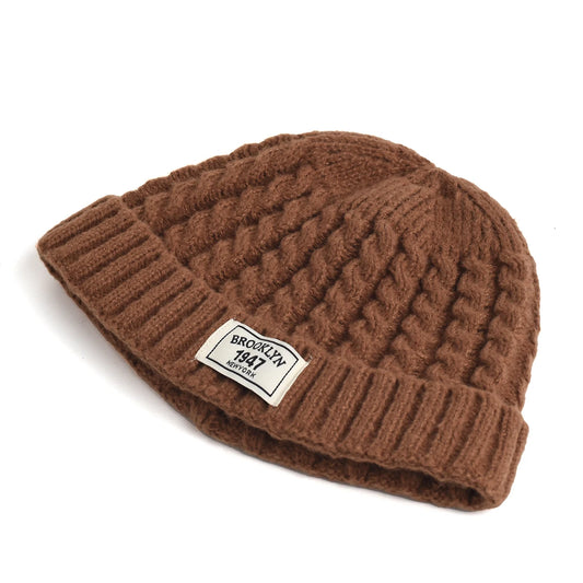 Brooklyn knitted beanie cap for men and women, warm wool skullie in solid color, perfect for autumn and winter fashion.