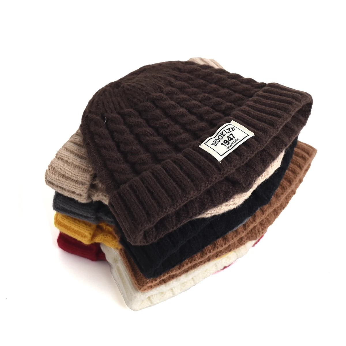 Brown Brooklyn knitted beanie cap for men and women, warm wool skullie with a simple, trendy winter fashion style.