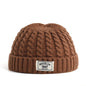 Brown Brooklyn knitted beanie cap for men and women, warm wool skullies hat with simple, trendy winter fashion style.