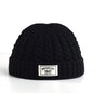 Brown Brooklyn knitted beanie cap for men and women, warm wool fashion skullie with simple, trendy style for autumn and winter.