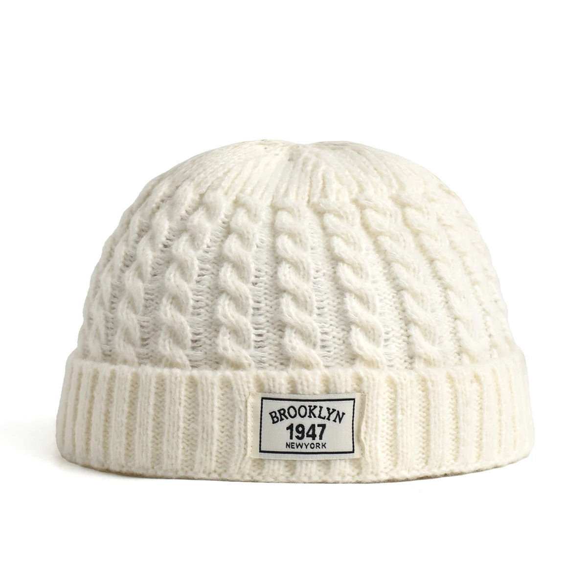 Brown Brooklyn knitted beanie cap for men and women, warm wool skullies with a simple, trendy winter fashion style.