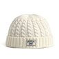 Brown Brooklyn knitted beanie cap for men and women, warm wool skullies with a simple, trendy winter fashion style.