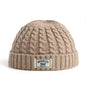 Brown Brooklyn knitted hat for men and women, wool beanie cap with simple, warm, solid design for autumn and winter fashion.