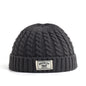 Brown Brooklyn knitted beanie hat for men and women, warm wool cap with simple, trendy design for autumn and winter.